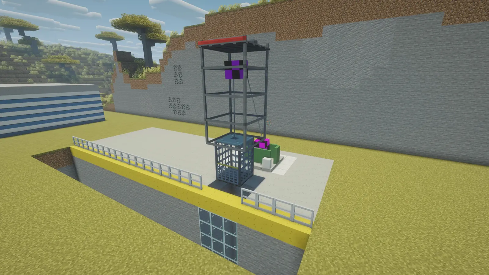 Headframe with a sheave over the shaft and the mine hoist beside it
